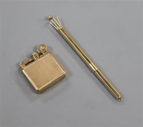 A small 1930s engine turned 9ct gold mounted lighter and a let 9ct gold swizzle stick.